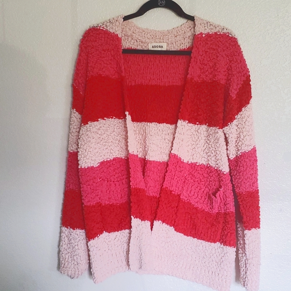 Adora pink and red fuzzy medium length cardigan.